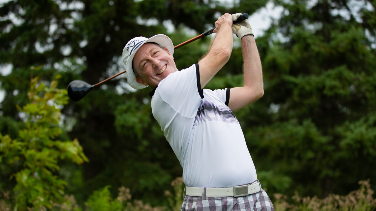 John Dickhout plays a round of golf with a smile.